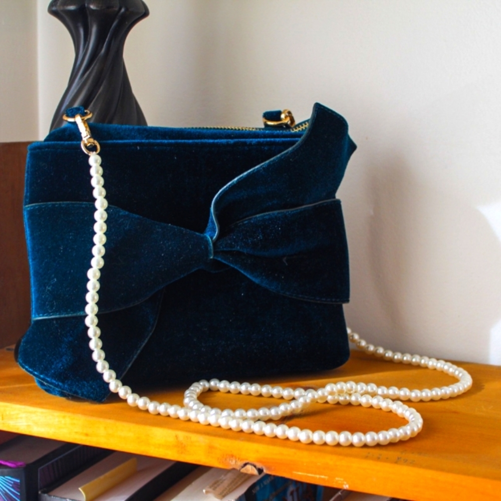 Teal velvet bow statement bag